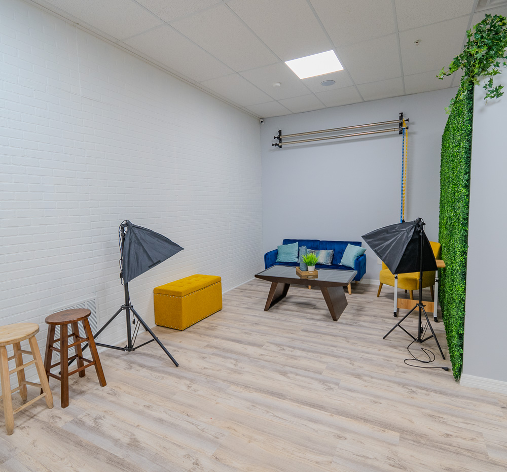 Photo lab with studio lights and backdrops at Work Social